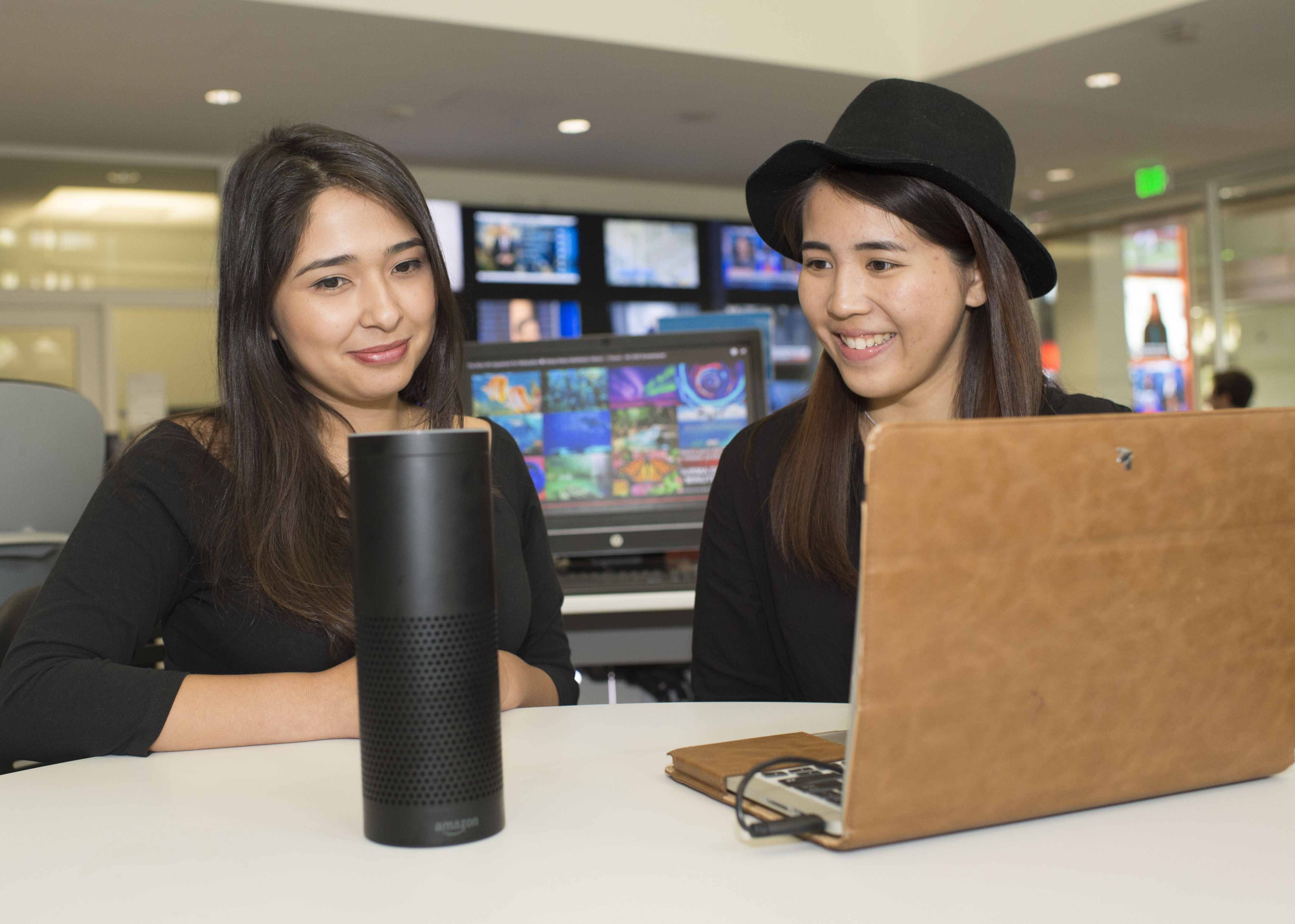 University of Southern California journalism students Cristina Galvan, left, and Almond Li worked on stories for Alexa in "Advanced Journalism for Mobile and Emerging Platforms" class. Photo by Alan Middlesteadt